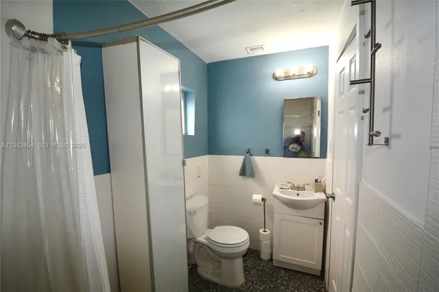 a view of a house with large tree