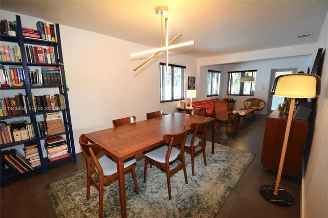 a kitchen with a refrigerator and a sink