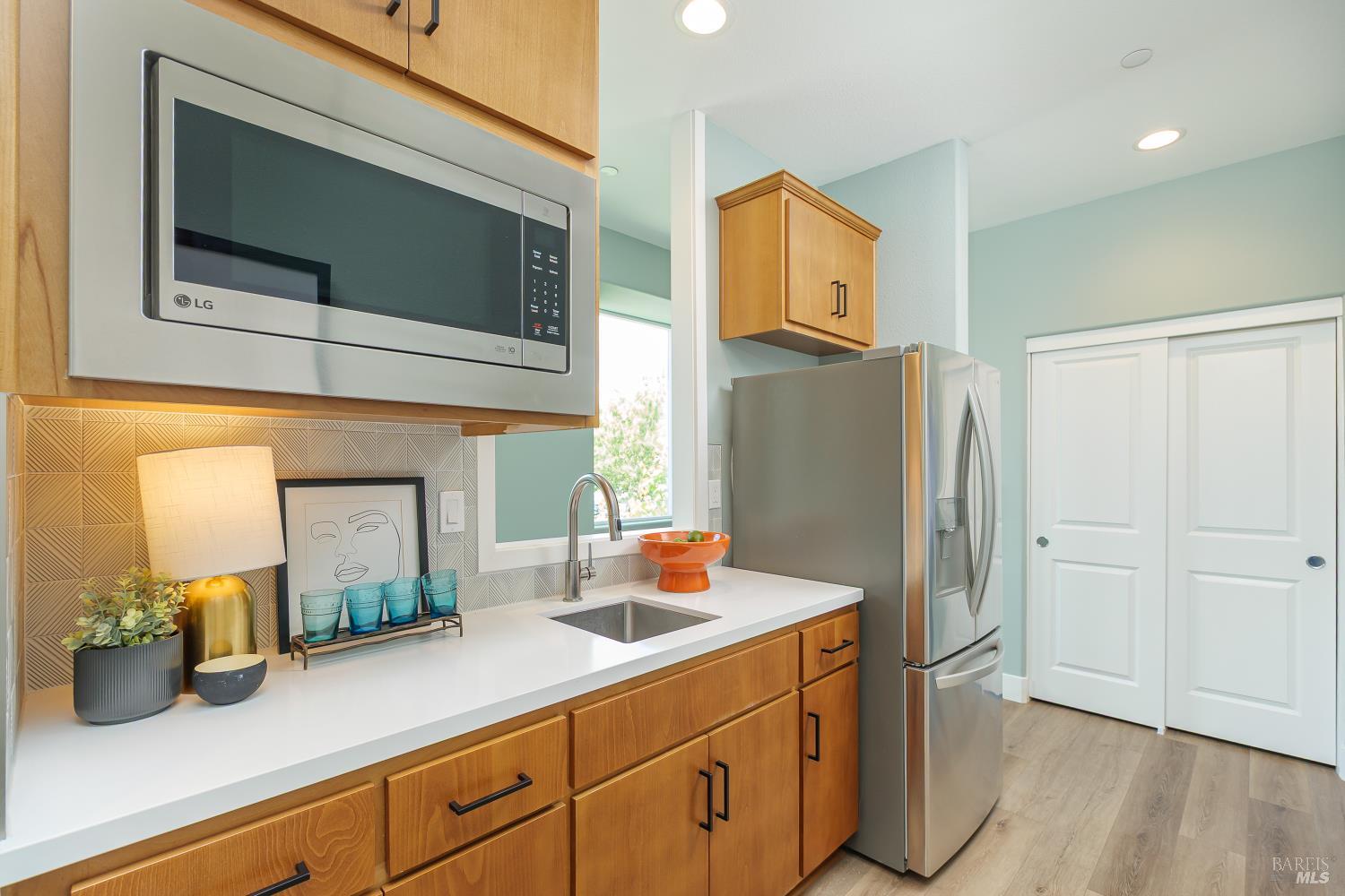 1201 Del Rancho Way Petaluma, CA 94954 - Photo 30 of 56 a kitchen with stainless steel appliances a refrigerator and a sink