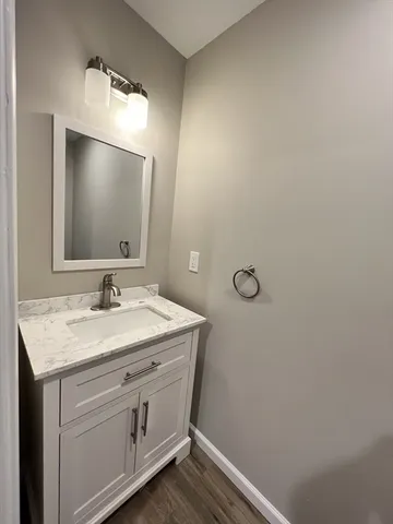a bathroom with a sink a vanity and a mirror