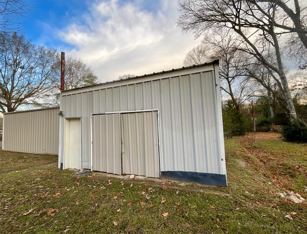 544 Keathley Road Lufkin, TX 75904 - Photo 11 of 15 a backyard of a house with wooden fence