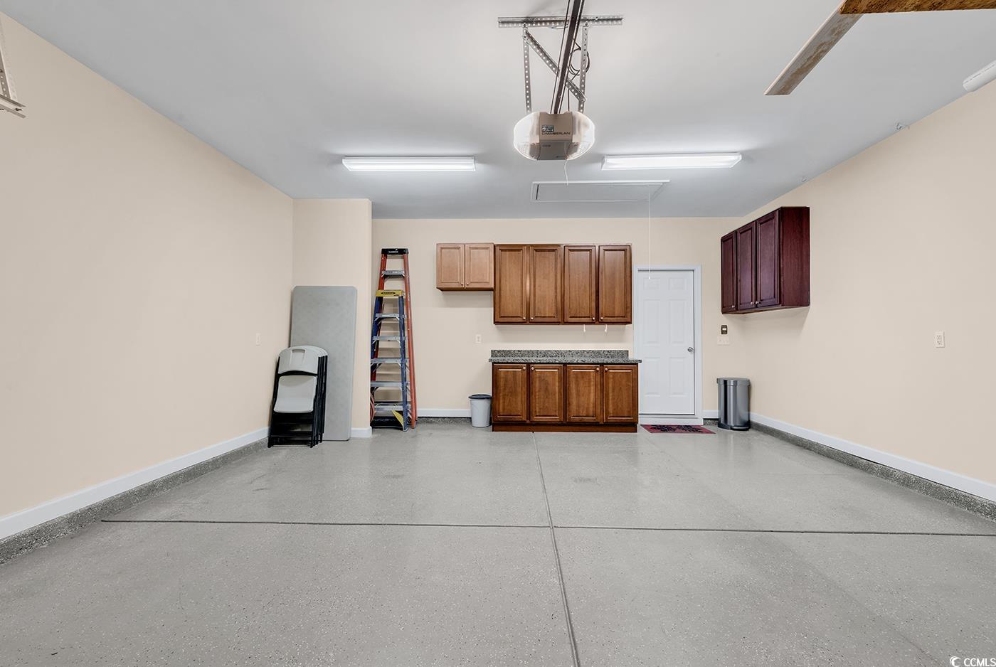 1612 Fairforest Court Conway, SC 29526 - Photo 33 of 40 Garage with baseboards and a garage door opener