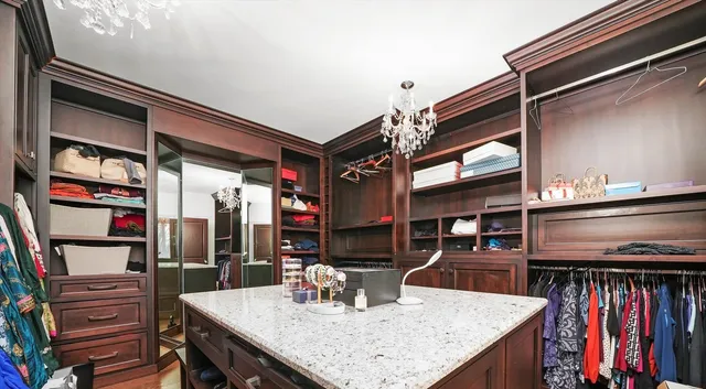 a bathroom with a toilet a sink and shower