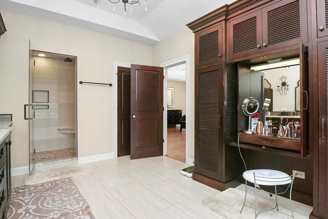 a living room with furniture a window and a chandelier