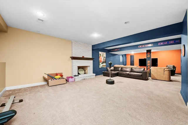 a bedroom with furniture and large window