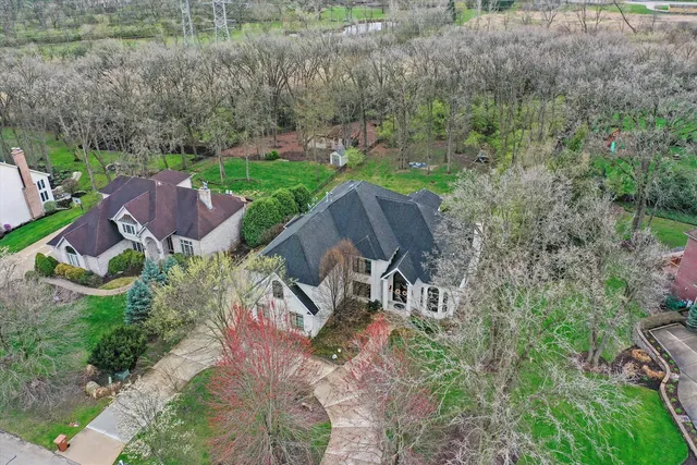 an aerial view of a house with a garden