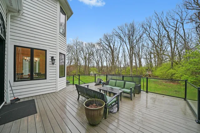a front view of a house with a yard table and chairs