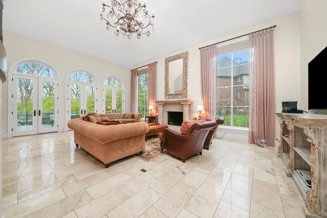 a living room with furniture and kitchen view
