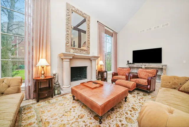 a kitchen with stainless steel appliances kitchen island granite countertop a table and chairs in it