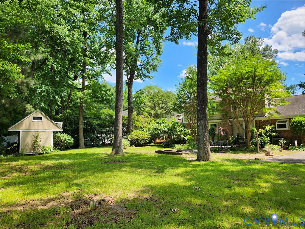 10260 Maplested Lane Henrico, VA 23229 - Photo 38 of 38 Expansive backyard featuring a lush lawn, mature t