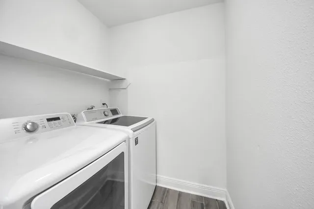 a backyard of a house with yard and outdoor seating