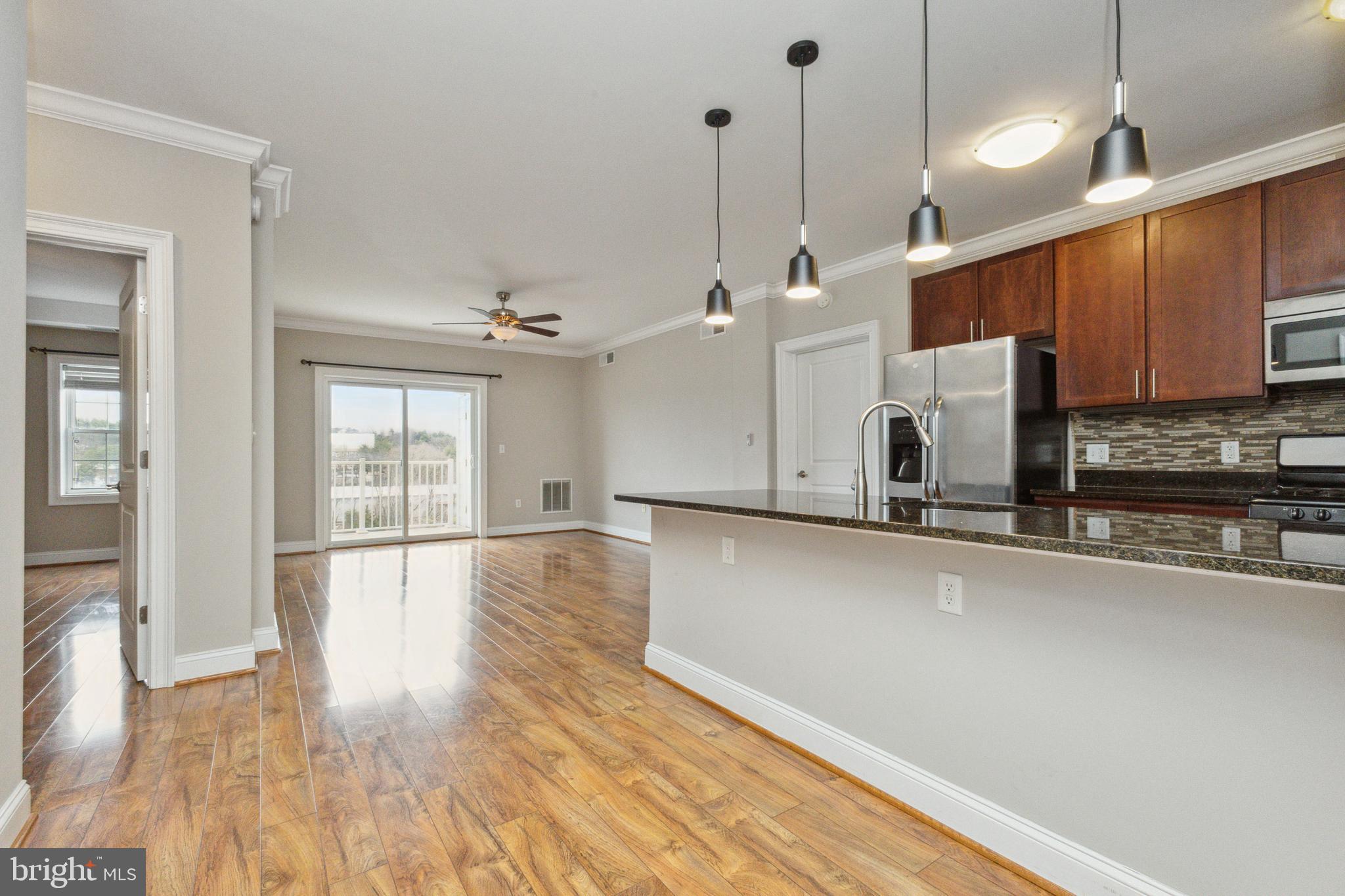 6301 Edsall Road, Unit 513 Alexandria, VA 22312 - Photo 15 of 38 a view of a kitchen with a sink and wooden floor