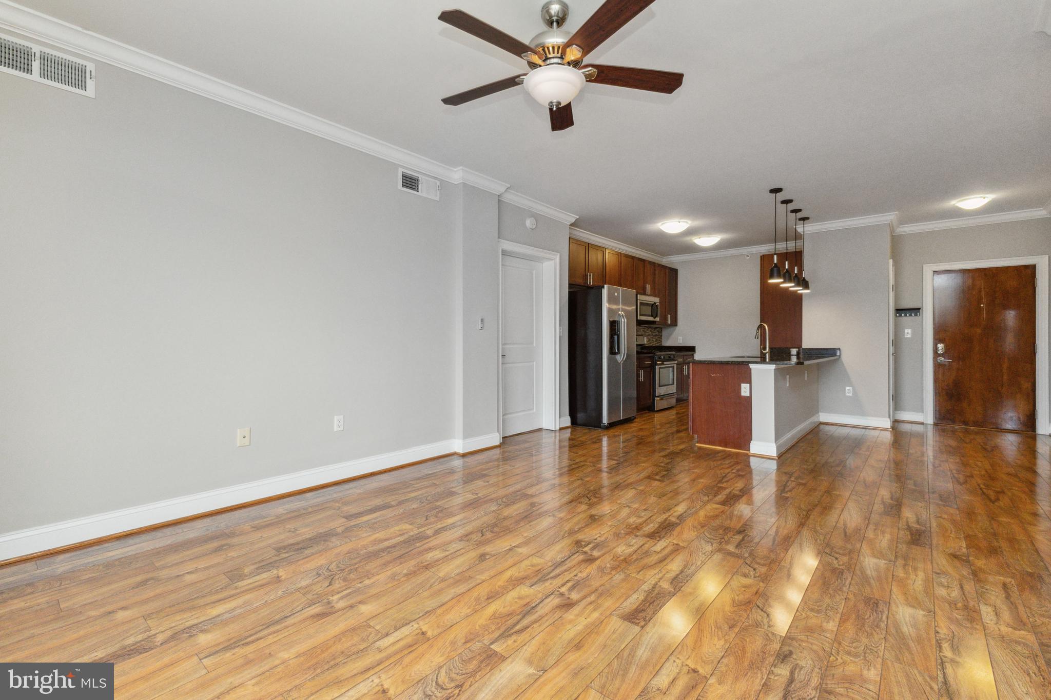 6301 Edsall Road, Unit 513 Alexandria, VA 22312 - Photo 18 of 38 a view of empty room with wooden floor and a window