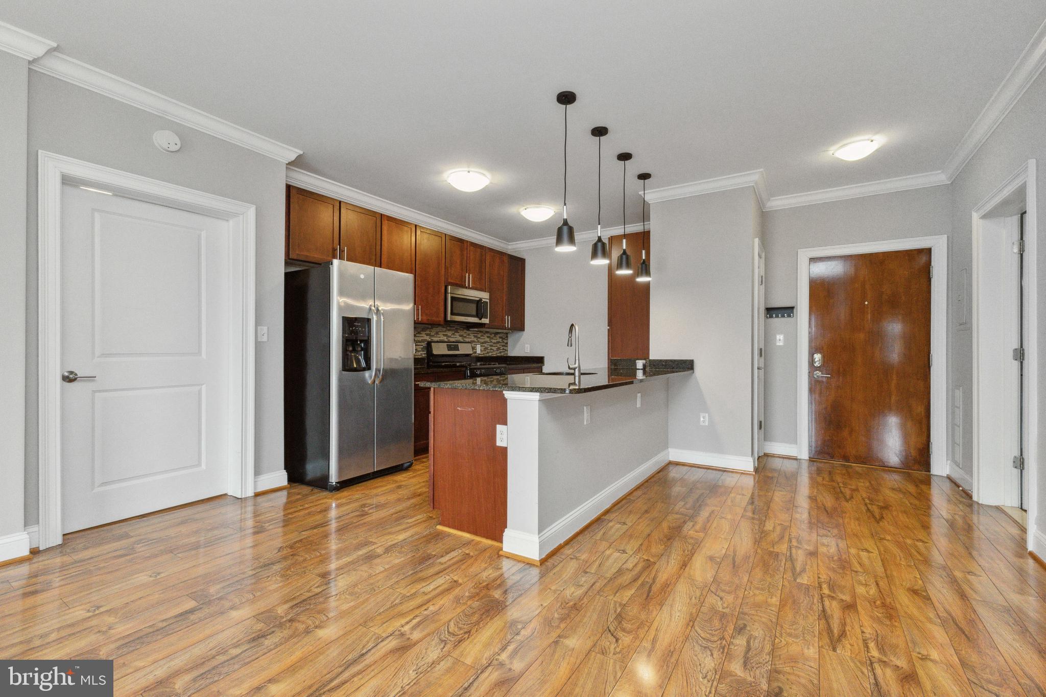 6301 Edsall Road, Unit 513 Alexandria, VA 22312 - Photo 20 of 38 a view of kitchen with refrigerator and wooden floor