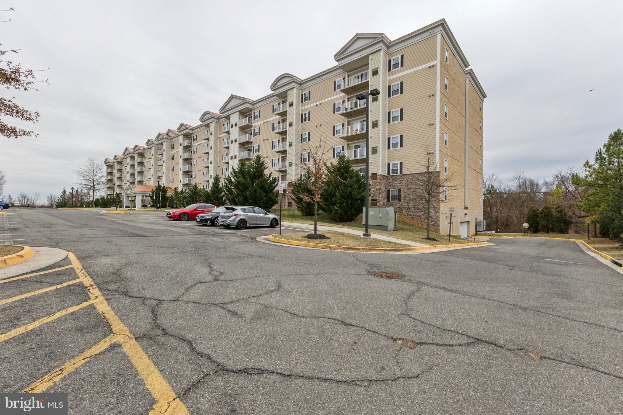 6301 Edsall Road, Unit 513 Alexandria, VA 22312 - Photo 2 of 38 a view of building with cars parked in front of it