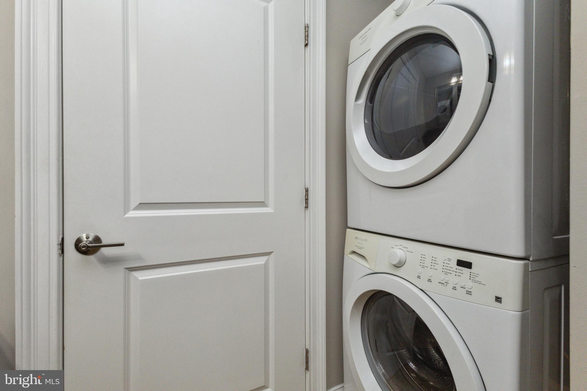 6301 Edsall Road, Unit 513 Alexandria, VA 22312 - Photo 23 of 38 a close view of a utility room with dryer and washer