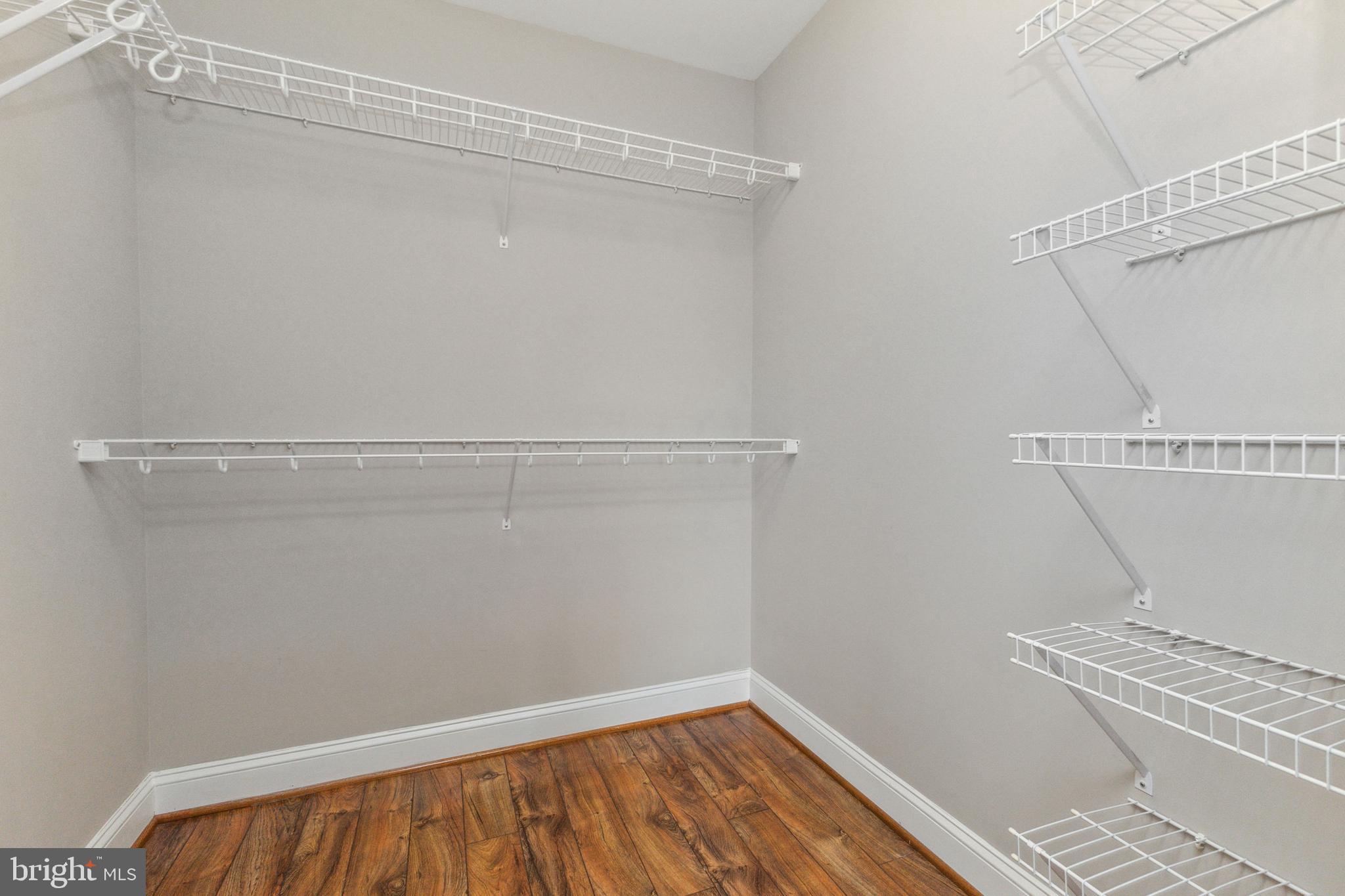 6301 Edsall Road, Unit 513 Alexandria, VA 22312 - Photo 25 of 38 a view of a room with wooden floor and white walls