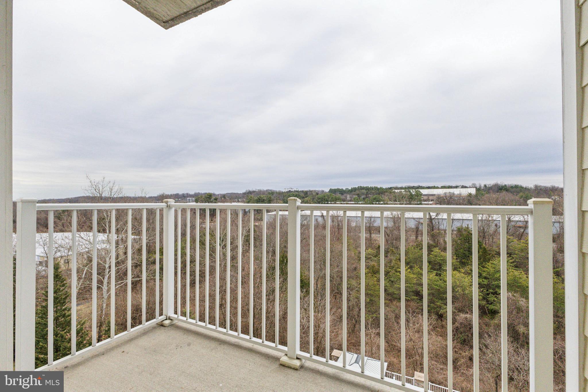 6301 Edsall Road, Unit 513 Alexandria, VA 22312 - Photo 34 of 38 a view of a balcony with wooden fence