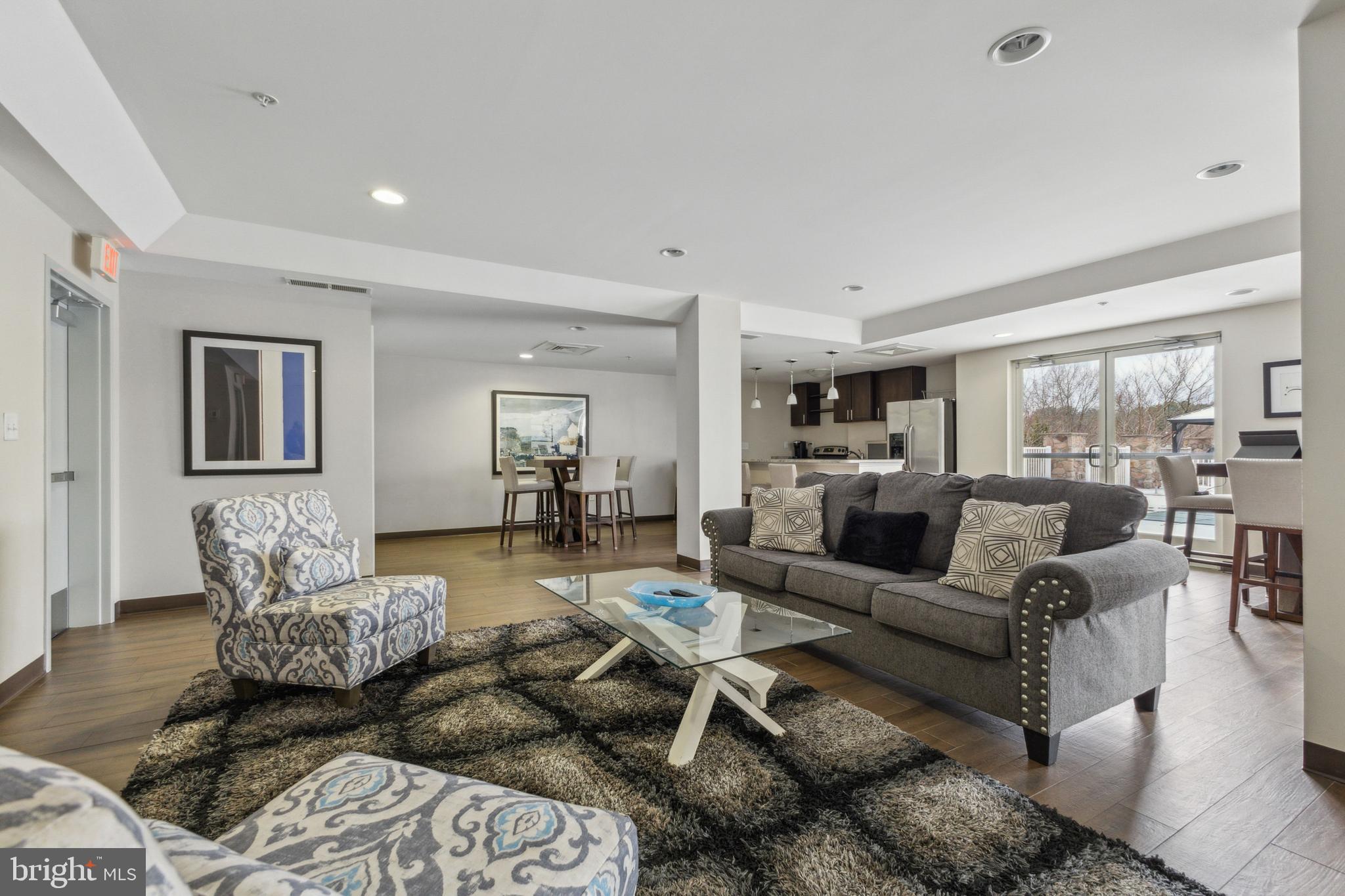 6301 Edsall Road, Unit 513 Alexandria, VA 22312 - Photo 6 of 38 a living room with furniture wooden floor and a large window