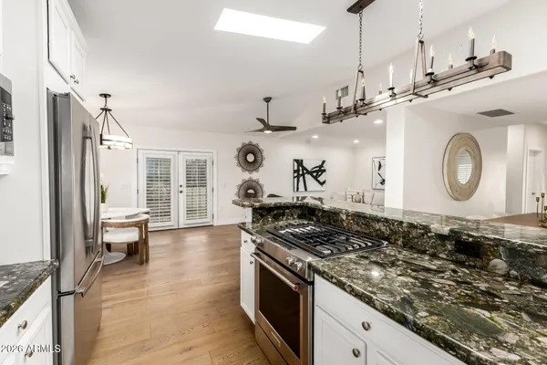 an empty room with a ceiling fan