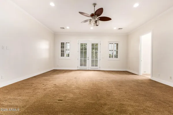 an aerial view of a house with a yard and large trees