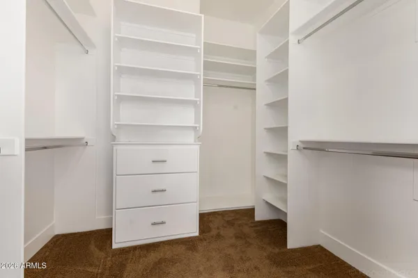 an aerial view of residential houses with outdoor space and street view
