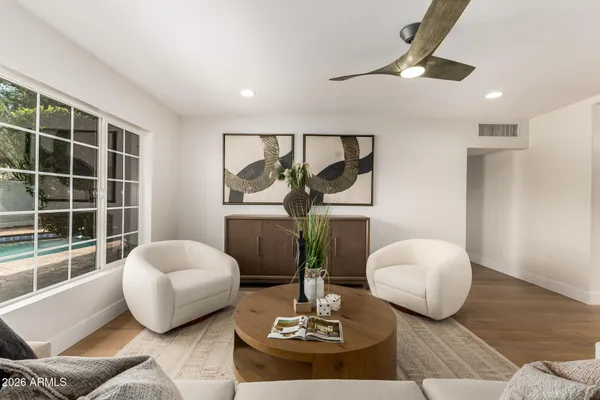 a living room with furniture and a large window