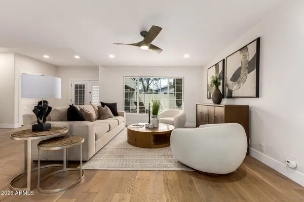 a living room with furniture and a potted plant