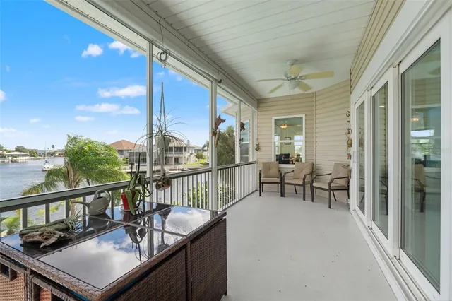 a view of a hallway with entryway wooden floor and front door