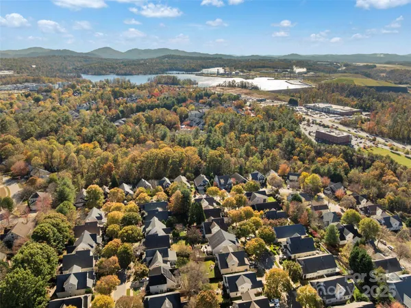 an aerial view of residential building with outdoor space and ocean view
