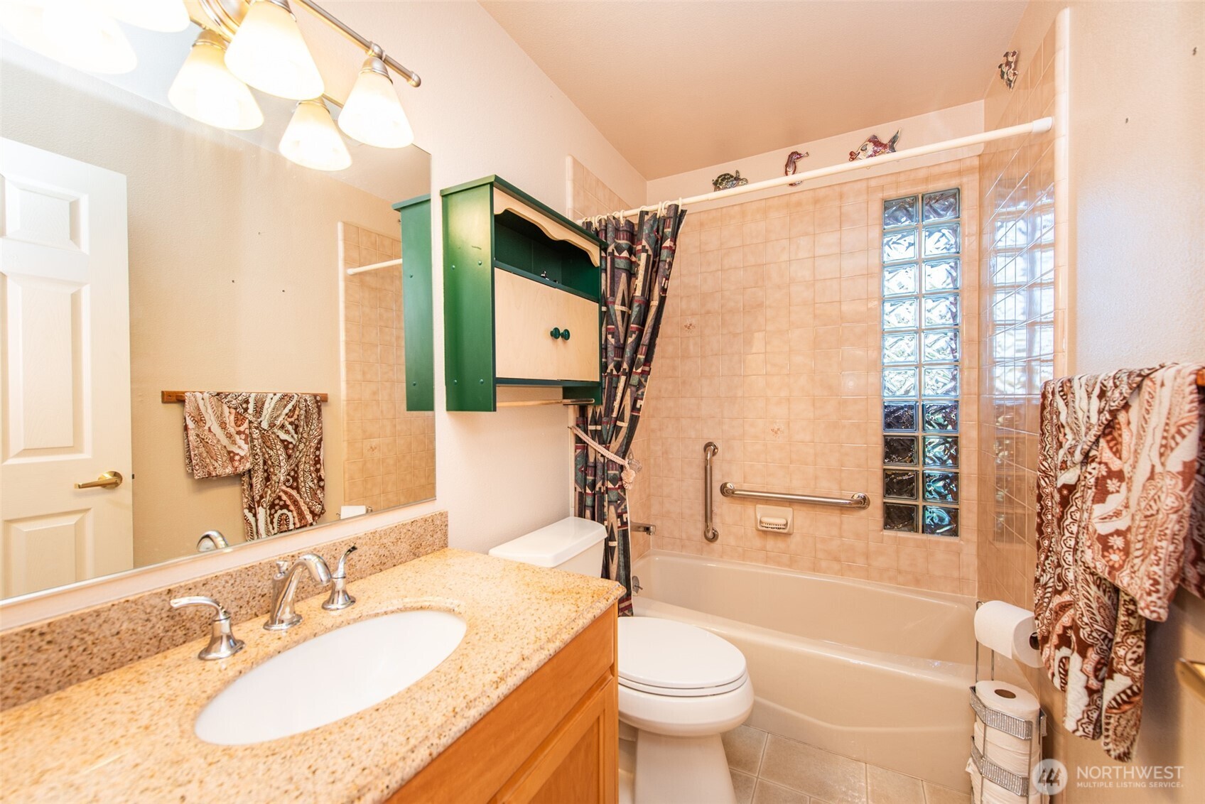 72 West Quail Lane Sequim, WA 98382 - Photo 13 of 29 a bathroom with a granite countertop sink and a mirror