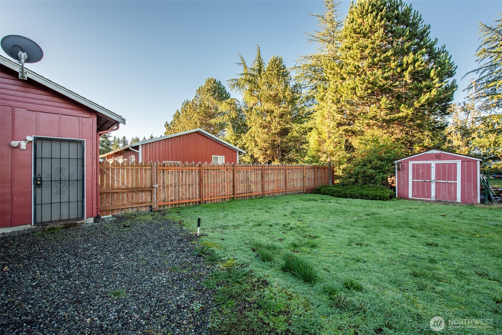 72 West Quail Lane Sequim, WA 98382 - Photo 23 of 29 a view of a backyard with potted plants and large tree