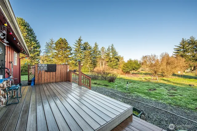 a view of a balcony with wooden floor