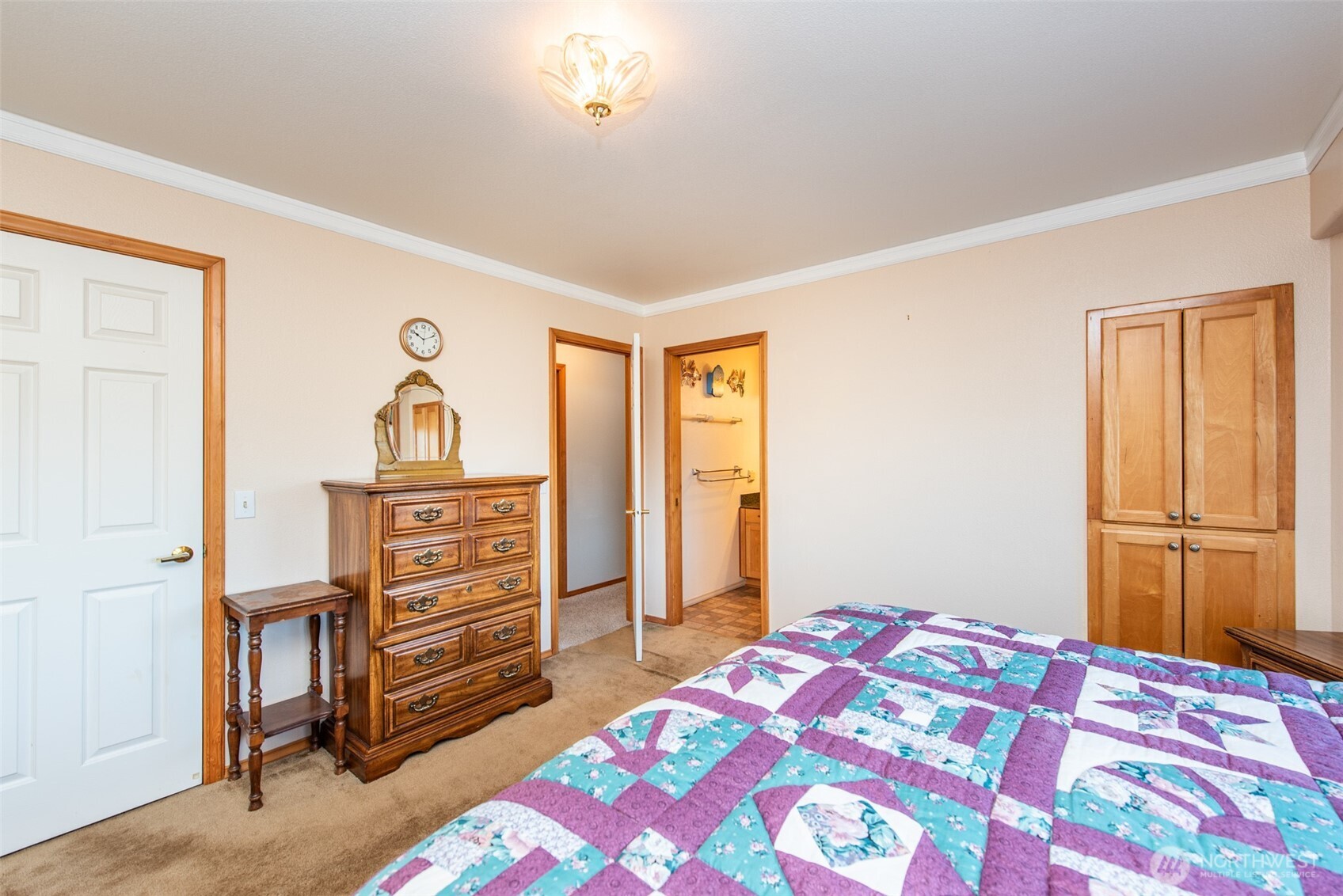 72 West Quail Lane Sequim, WA 98382 - Photo 10 of 29 a bedroom with a bed and a dresser