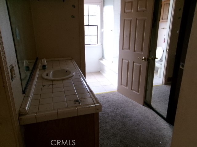 17392 Cache Creek Road Clearlake Oaks, CA 95423 - Photo 14 of 25 a bathroom with a sink and a vanity
