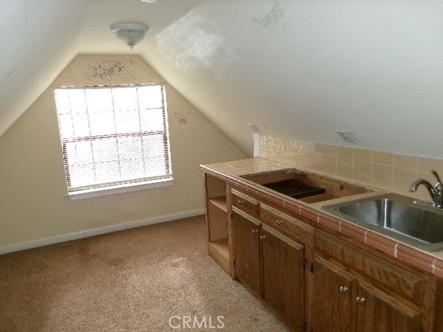 17392 Cache Creek Road Clearlake Oaks, CA 95423 - Photo 23 of 25 a kitchen that has a sink and a stove