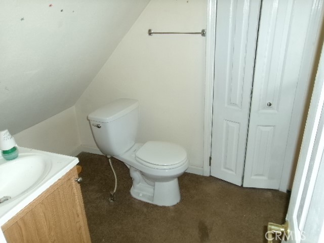 17392 Cache Creek Road Clearlake Oaks, CA 95423 - Photo 24 of 25 a white toilet sitting next to a sink