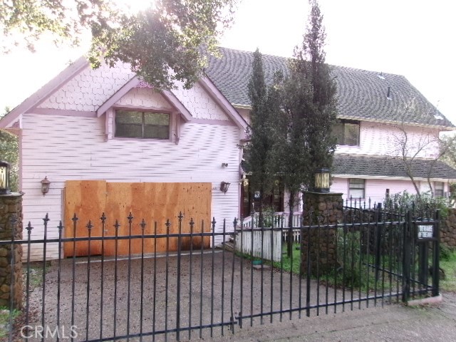 17392 Cache Creek Road Clearlake Oaks, CA 95423 - Photo 4 of 25 a view of a brick house with a small yard