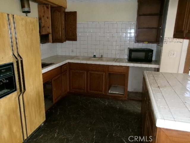 17392 Cache Creek Road Clearlake Oaks, CA 95423 - Photo 10 of 25 a kitchen with stainless steel appliances a refrigerator and a stove