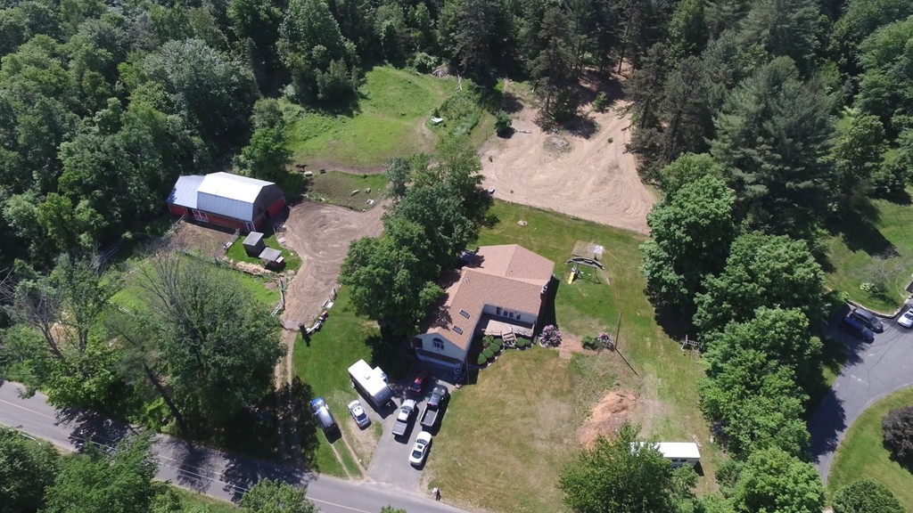 135 Fenton Road Monson, MA 01057 - Photo 1 of 30 an aerial view of a house with a yard and lake view