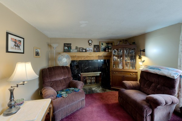 135 Fenton Road Monson, MA 01057 - Photo 11 of 30 a living room with furniture and a fireplace