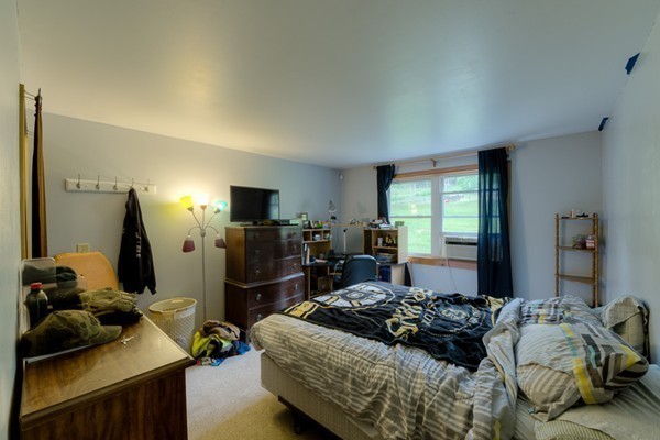 135 Fenton Road Monson, MA 01057 - Photo 13 of 30 a bedroom with a bed and large windows