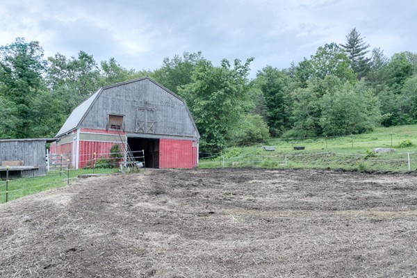135 Fenton Road Monson, MA 01057 - Photo 2 of 30 a view of a barn in the middle of a yard