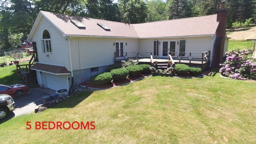 135 Fenton Road Monson, MA 01057 - Photo 30 of 30 a view of a patio with table and chairs potted plants