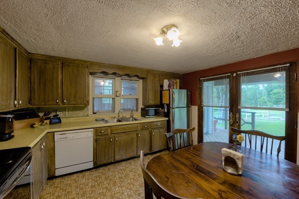 135 Fenton Road Monson, MA 01057 - Photo 6 of 30 a kitchen with sink refrigerator and large window