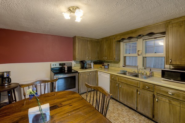 135 Fenton Road Monson, MA 01057 - Photo 8 of 30 a kitchen with a sink dishwasher stove and cabinets