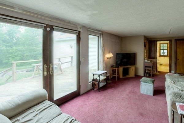 135 Fenton Road Monson, MA 01057 - Photo 9 of 30 a living room with furniture and a flat screen tv
