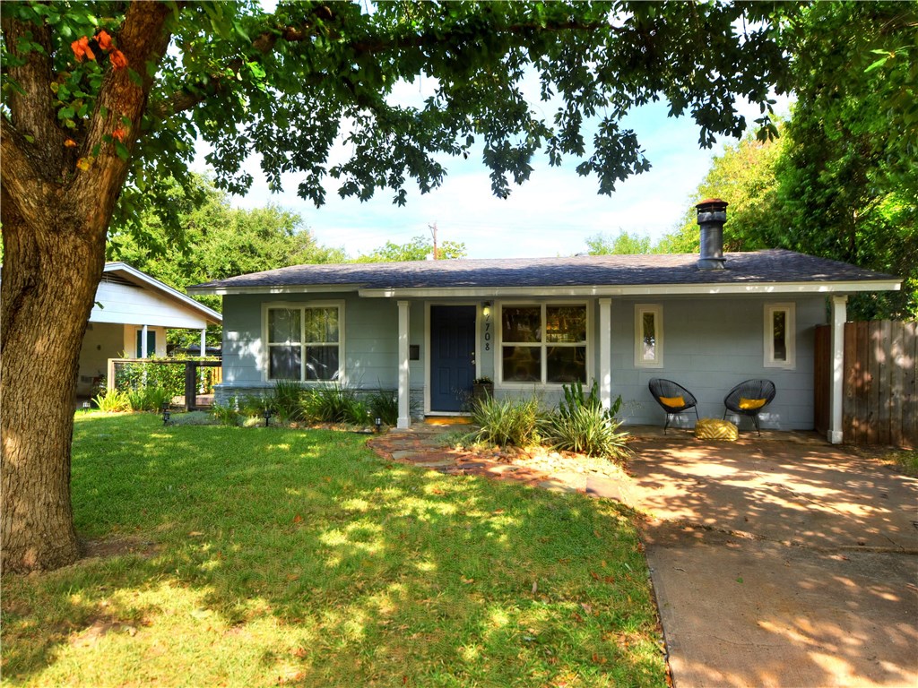 7708 Rutgers Avenue Austin, TX 78757 - Photo 1 of 1 a front view of house with yard outdoor seating and green space