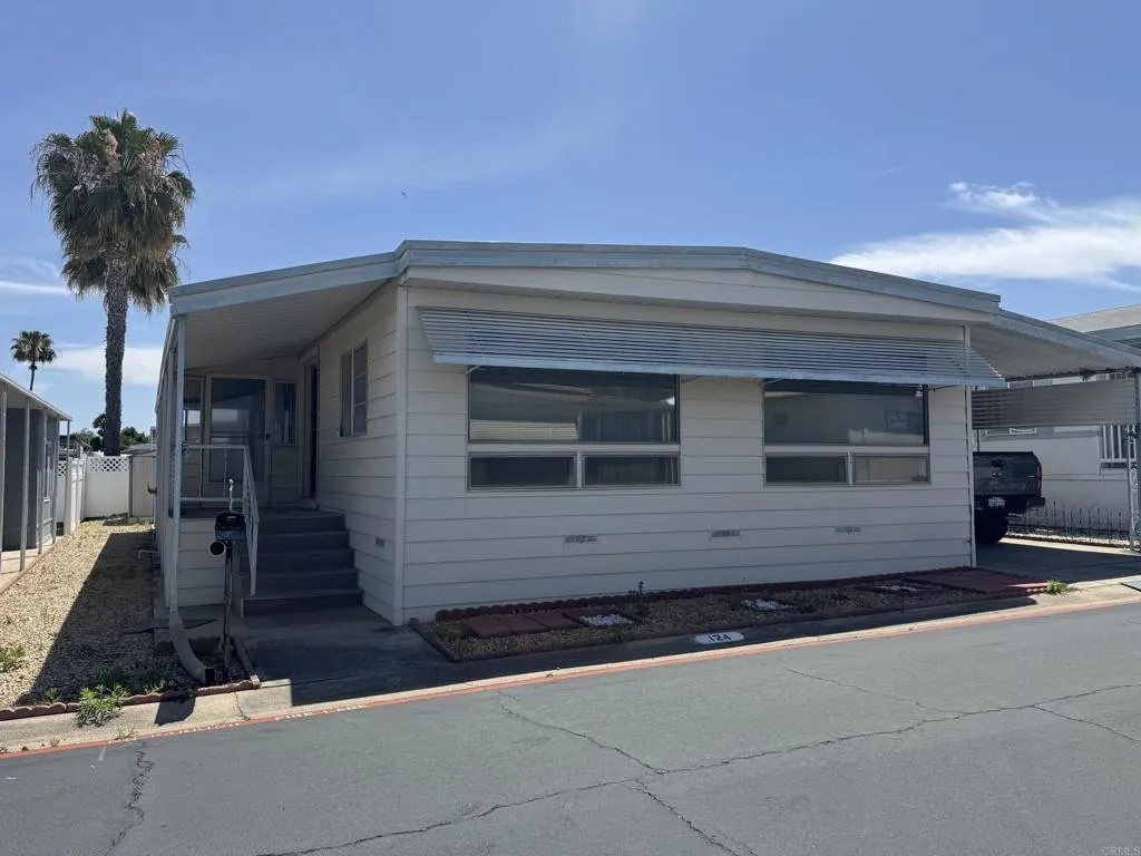 a front view of a house with yard