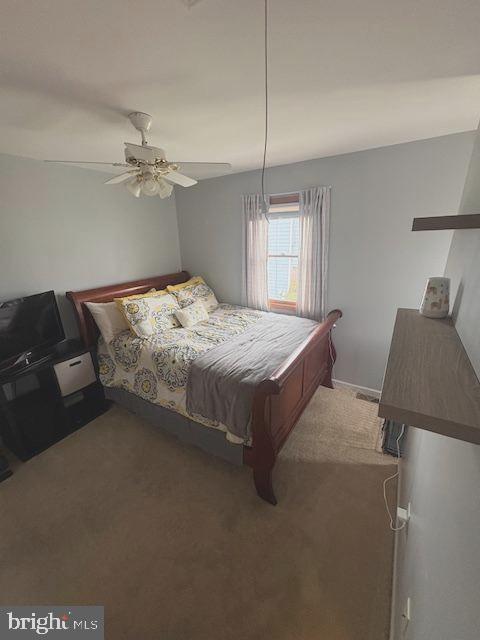 219 Connor Street Norristown, PA 19401 - Photo 27 of 38 a bed sitting in a bedroom next to a window with a chandelier